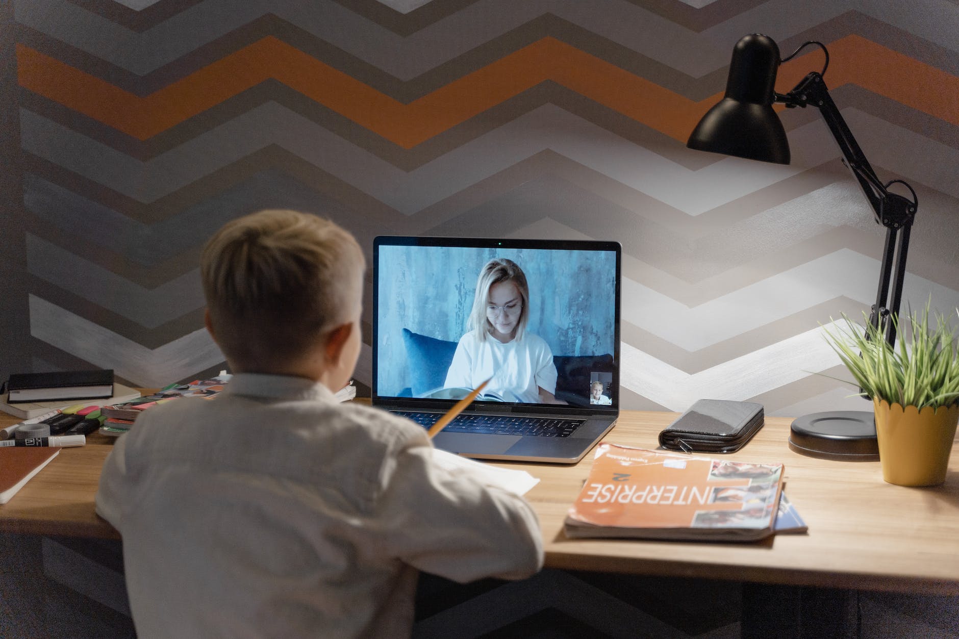 a boy attending an online class