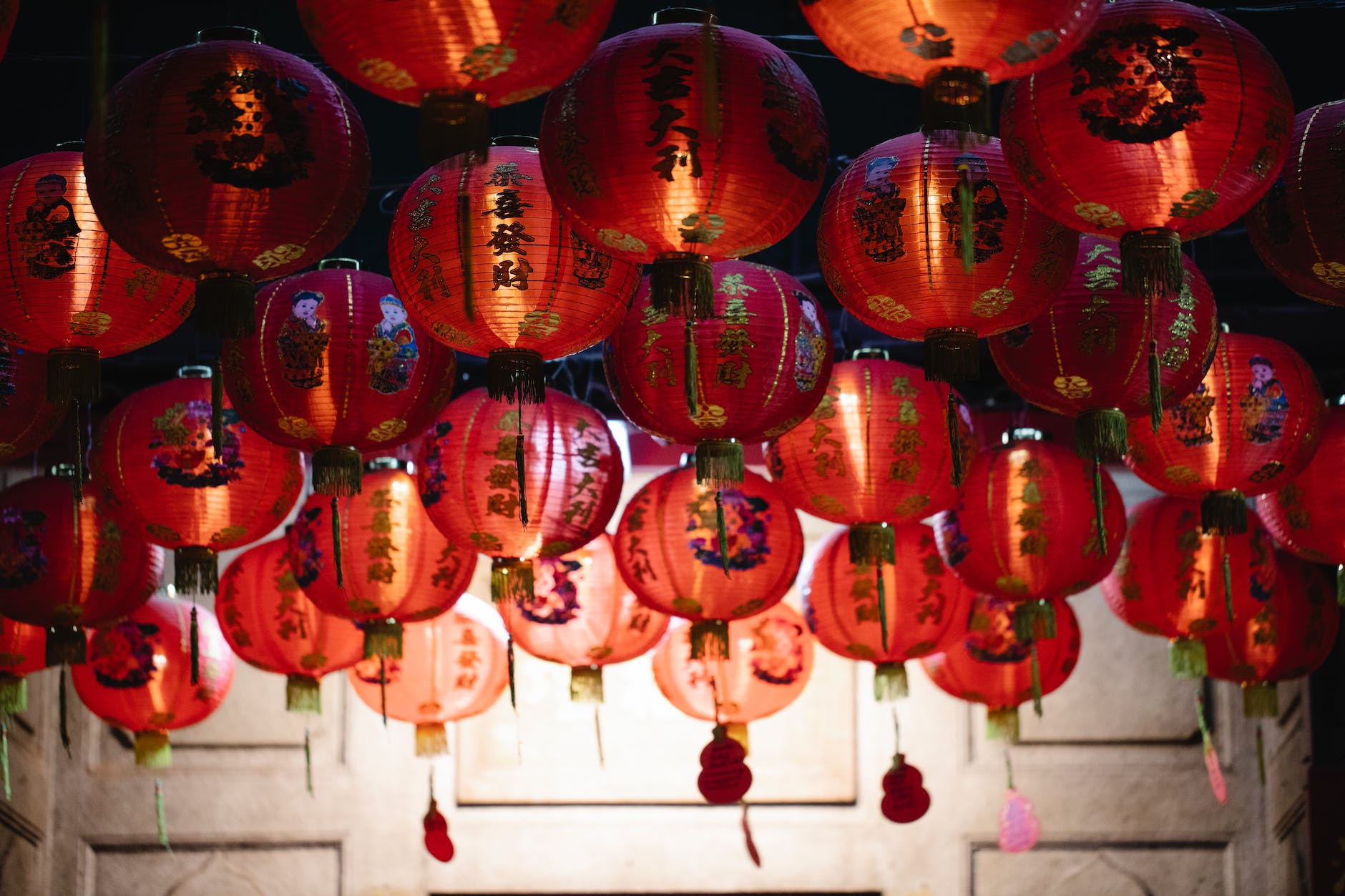 traditional asian paper lanterns hanging on street at night