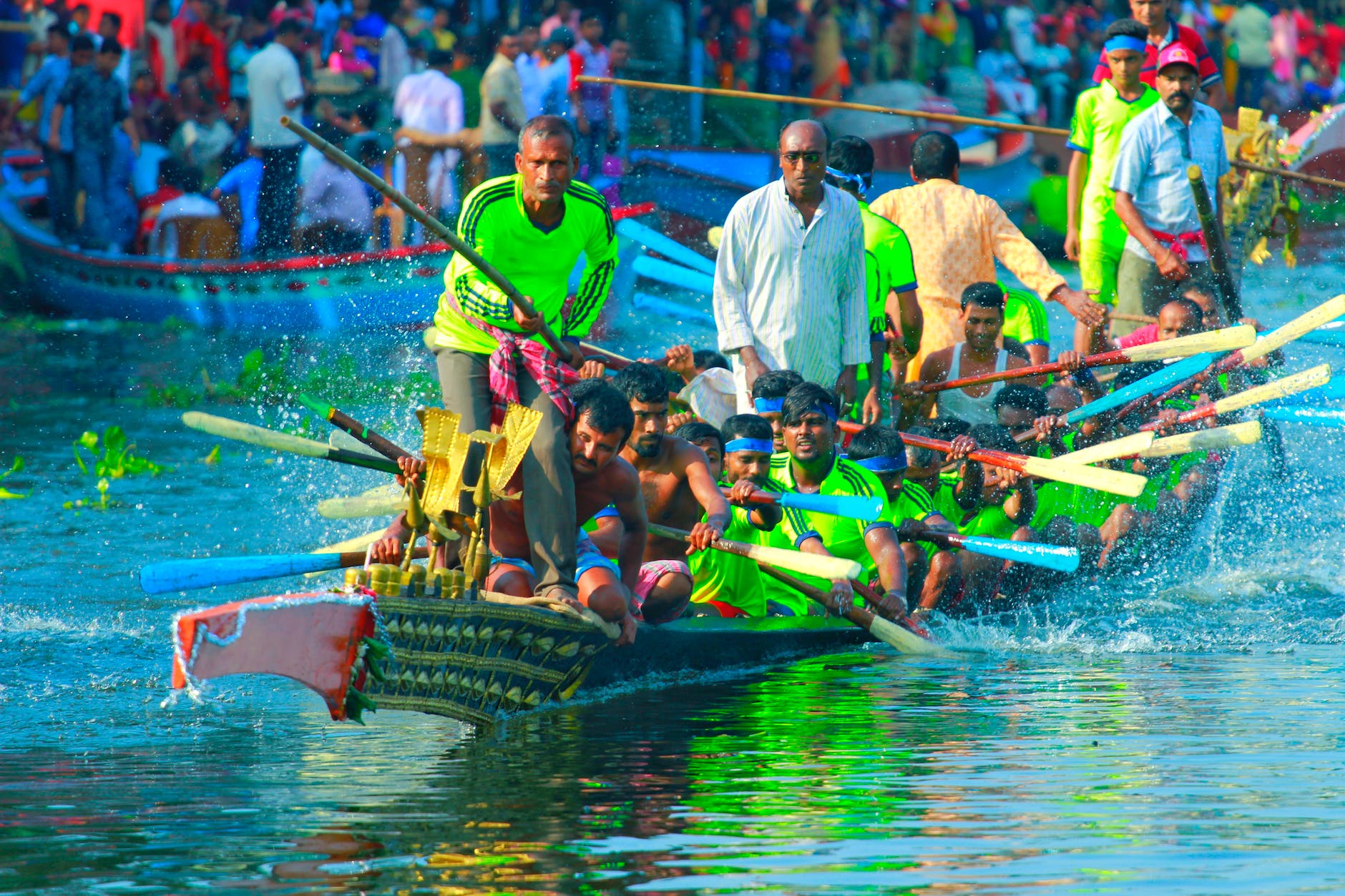 athletes riding on a dragon boat